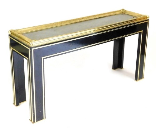 A late 20thC French ebonised and brass console table, of rectangular section, with a glass inset top and embossed leaf scroll corners, raised on square legs, 76cm high, 145cm wide, 41cm deep.