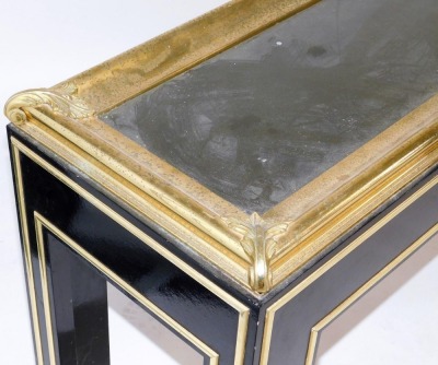 A late 20thC French ebonised and brass console table, of rectangular section, with a glass inset top and embossed leaf scroll corners, raised on square legs, 76cm high, 145cm wide, 41cm deep. - 2