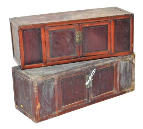 Two Chinese hardwood table top chests, each with a pair of fronted doors, 40cm high, 110cm wide, 39cm deep and 38cm high, 105cm wide, 38cm deep. (2)