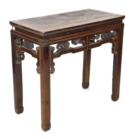 A Chinese elm side table, of rectangular section, with a carved frieze, raised on square legs, 84cm high, 91cm wide, 46cm deep.