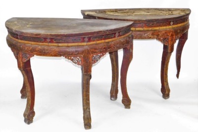 A pair of Chinese red lacquered hardwood demi lune side tables, foliate carved and faux bamboo frieze, raised on cabriole legs, 93cm high, 128cm wide, 64cm deep. - 2