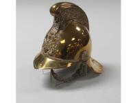 A 19thC brass fireman's helmet with chin strap