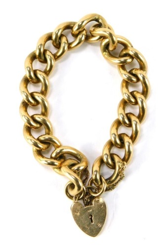 A 9ct gold heavy curb link bracelet, with heart shaped padlock clasp, safety chain as fitted, marked 375 to padlock, 109.1g.