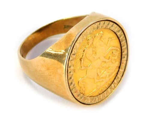 A George V half gold sovereign, dated 1918, in a 9ct gold ring mount, London 1986, size R, 8.8g.