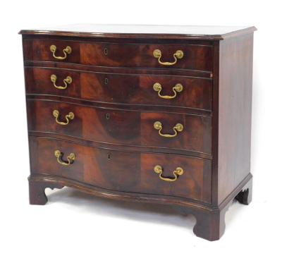 A George III figured mahogany serpentine fronted chest, of four drawers with triple veneer fronts and brass swans neck handles, with reeded flat pilasters, on shaped bracket feet, 82cm high, 93cm wide, 52cm deep.