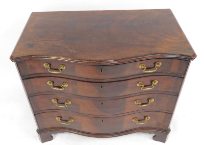 A George III figured mahogany serpentine fronted chest, of four drawers with triple veneer fronts and brass swans neck handles, with reeded flat pilasters, on shaped bracket feet, 82cm high, 93cm wide, 52cm deep. - 3