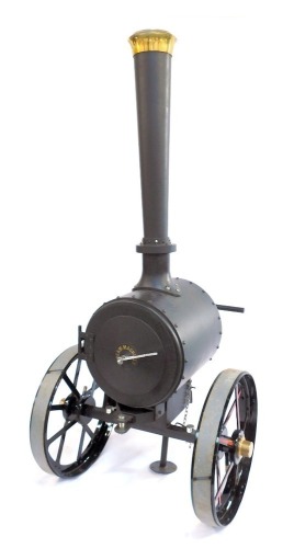 House of Douglas Collection. Cold riveted steel steam BBQ or log burner, modelled as a steam traction engine, approx 205cm high, 95cm wide, 96cm deep.  NB. Listed in HoD catalogue at £4,950.