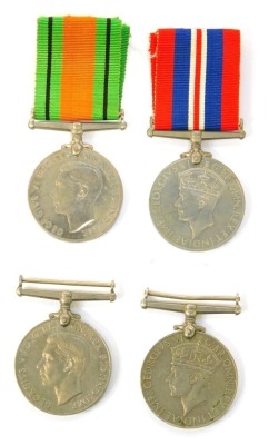 Four WWII medals, comprising three 1939-45 War medals and a Defence medal, two with ribbons.