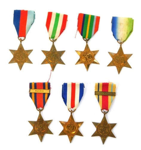 Seven WWII medals, comprising the Atlantic Star, the Pacific Star, the 1939-45 Star, the France and Germany Star, the Italy Star, the Burma Star with Pacific bar and the Africa Star with 1st Army bar, each with ribbons.