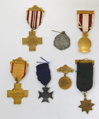 A group of Red Cross enamelled medals, named to M Turner 4482, Hilda Wollen 6851, HM Simmons 25718 and another numbered 32455, together with a medallion from the Royal Society for the Prevention of Accidents 10 years safe driving, driving 1946, Primitive - 2