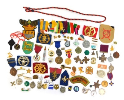 Various medals, medallions, cloth badges etc., to include a replica Victoria Cross, Boys Brigade enamel badge, Surrey County Council attendance medal, medal ribbons, etc.