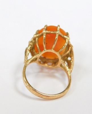 A 9ct gold cameo dress ring, the oval cameo depicting figure with scrolling hair, in a raised basket with leaf moulded shoulders, size N½, 6.6g all in. - 2