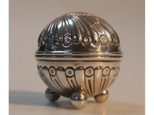 A late Victorian silver circular salt with gadroon decoration on ball feet