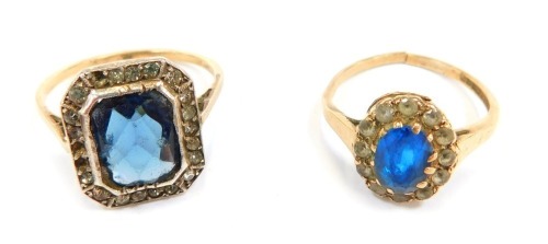 Two dress rings, comprising an Art Deco style dress ring, set with blue and white paste stones, yellow metal unmarked, and a 9ct gold dress ring, formed as an oval cluster set with blue and white paste stones, 5.6g all in, cut. (2)