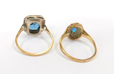 Two dress rings, comprising an Art Deco style dress ring, set with blue and white paste stones, yellow metal unmarked, and a 9ct gold dress ring, formed as an oval cluster set with blue and white paste stones, 5.6g all in, cut. (2) - 2