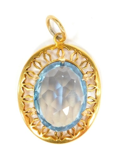 A 9ct gold pendant, with central light blue stone, possibly a topaz, in a pierced outer frame, one claw missing, 2.5cm x 1.5cm, 7.9g all in.