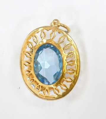 A 9ct gold pendant, with central light blue stone, possibly a topaz, in a pierced outer frame, one claw missing, 2.5cm x 1.5cm, 7.9g all in. - 2