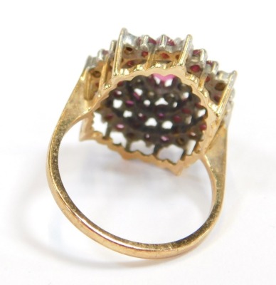 A 9ct gold cluster ring, the circular cluster set with halos of CZ and rubies, size P½, 4.9g all in. - 2