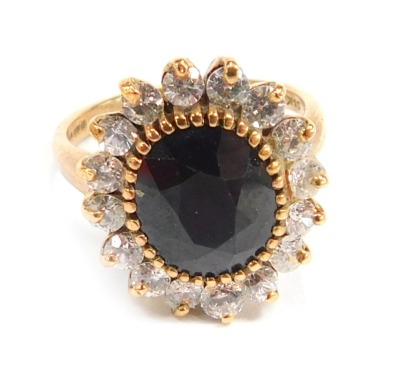 A 9ct gold cluster ring, set with paste stones, ring size M½, 4.9g all in.