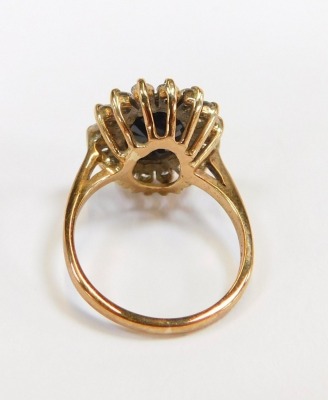 A 9ct gold cluster ring, set with paste stones, ring size M½, 4.9g all in. - 2