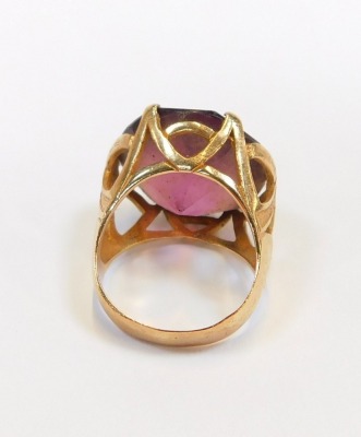 A 9ct gold dress ring, set with purple paste stone, in a chunky raised basket setting, ring size O, 10.1g all in. - 2