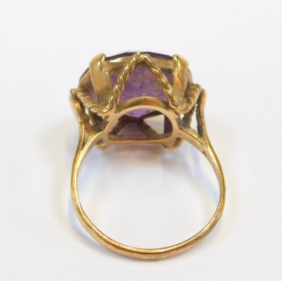 A 9ct gold dress ring, with circular purple paste stone, in claw setting with rope twist raised basket, ring size N½, 5g all in. - 2