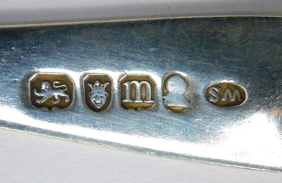 Three Georgian silver dessert spoons, comprising an Old English pattern example with bright cut decoration, London 1787, and two further spoons, initial engraved, hallmarks rubbed, 1.50oz, - 3