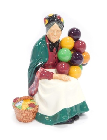 A Royal Doulton porcelain figure, modelled as The Old Balloon Seller, HN1315.