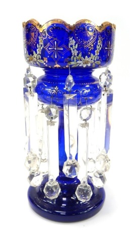 A Victorian Bristol Blue glass lustre, decorated with painted flowers and gilt heightened decoration, with various faceted glass drops, 36cm high.