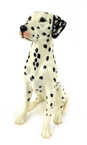 A Beswick pottery figure modelled as a seated Dalmatian, 34cm high.