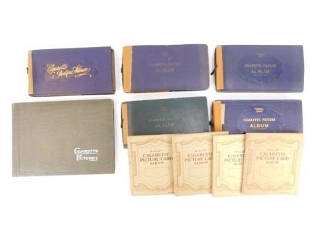 A quantity of cigarette cards in albums, to include Wills's Life In The Royal Navy, Railway Equipment, Our King and Queen, Player's, etc. (a quantity)