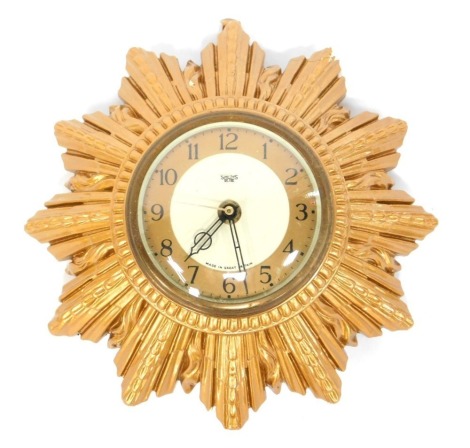 A Smiths Sectric sunburst wall clock, with circular Arabic numeral dial, quartz movement, 20cm diameter.