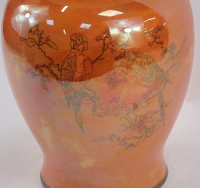 WITHDRAWN PRE SALE BY VENDOR. A Carltonware orange lustre jar and cover, of large proportion with dog of fo handle and hand painted black detail of parrots, on an orange ground, 49cm high. (AF) - 2