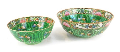 Two 20thC Chinese famille rose bowls, each decorated internally and externally with cabbage leaves, flowers and butterflies, 21cm and 16cm diameter respectively. (2)