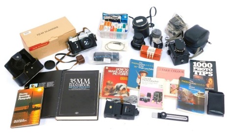 A group of cameras and related equipment, to include a Zenit-B camera, in case, a Prinzflex 28mm lens, further lens, a film scanner, various photography related books, etc. (1 box)