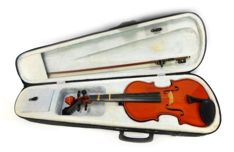 A modern two piece violin, 58cm long, together with a bow, in a fitted canvas case. NB. We have specific vendor instructions to sell WITHOUT RESERVE.