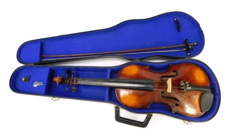 A late 19th/early 20thC two piece violin, unsigned, 59cm long, together with a bow, in fitted case. NB. We have specific vendor instructions to sell WITHOUT RESERVE.