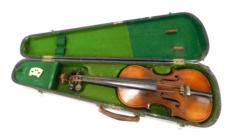 A 20thC two piece split back violin, unsigned, 54cm long, lacking bow, cased. NB. We have specific vendor instructions to sell WITHOUT RESERVE.