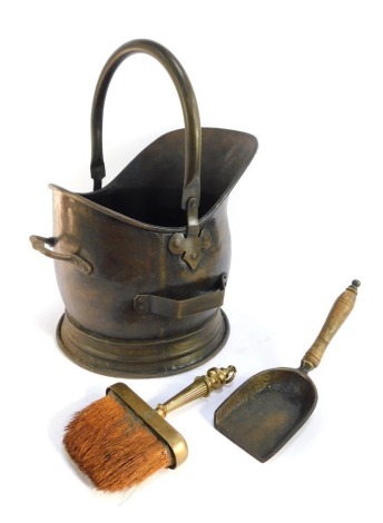 A brass helmet shaped coal scuttle, with scoop, and associated brush. (3)