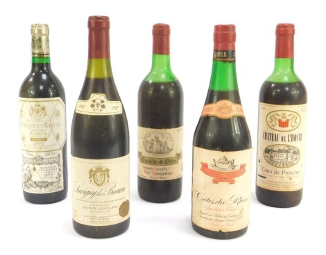 Five bottles of vintage French wine, comprising Savigny las Beaune 1987, Cotes du Rhone, Castillo de Olite 1976, Marques de Riscal 2001 Rioja, Chateau de L'hoste.