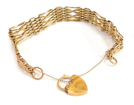 A 9ct gold gate bracelet, of four bar design, with safety chain and heart shaped padlock, 18cm long, 15.3g all in.