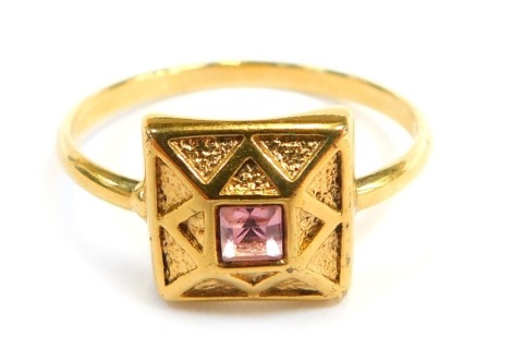 A dress ring, set with central pink topaz, in a faceted square ring head, on yellow metal band, unmarked, believed to be 9ct gold, ring size S½, 2.4g all in.