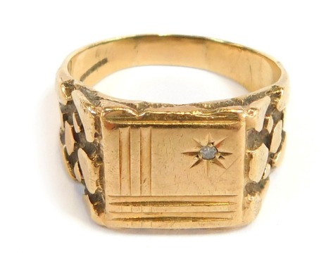 A 9ct gold signet ring, with square beaded panel set with tiny diamond, with bark effect shoulders, ring size Y½, 9.3g all in.