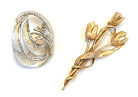 A tree branch tulip brooch, intertwined white metal stamped 925, 5.5cm high, 9.8g, and a Trifari costume brooch. (2)