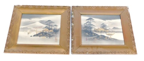 Two Japanese wood block prints, depicting houses before Mount Fuji, the other depicting houses before lake, gilt heightened, bearing various character marks, 24cm x 29cm.