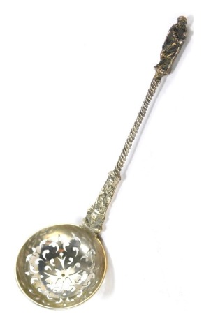 A Victorian silver sifter spoon, with apostle handle, and twist stem inscribed PER MARE, bearing crucifix, London 1858, 1.41oz.