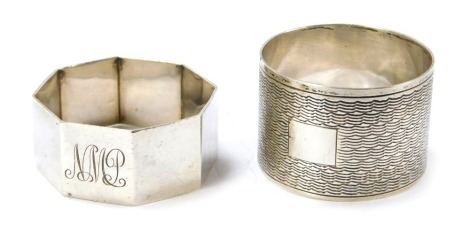 Two silver napkin rings, one of octagonal form, the other of engine turned decoration, 1.65oz. (2)