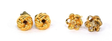 Two pairs of gold plated stud earrings.