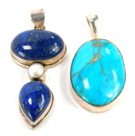 Two modern pendants, comprising a silver lapis and blister pearl pendant, 8cm high, and a turquoise and silver bordered oval pendant, 7cm high. (2)