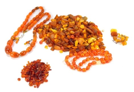 A group of loose amber beads, mainly butterscotch, rough cut, etc., 404.9g all in.